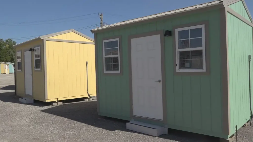 st. louis tiny homes project expands with bold housing solutions 1 Colorful tiny homes at a transitional housing village in St. Louis, part of the city's Tiny Homes Project for unhoused residents.