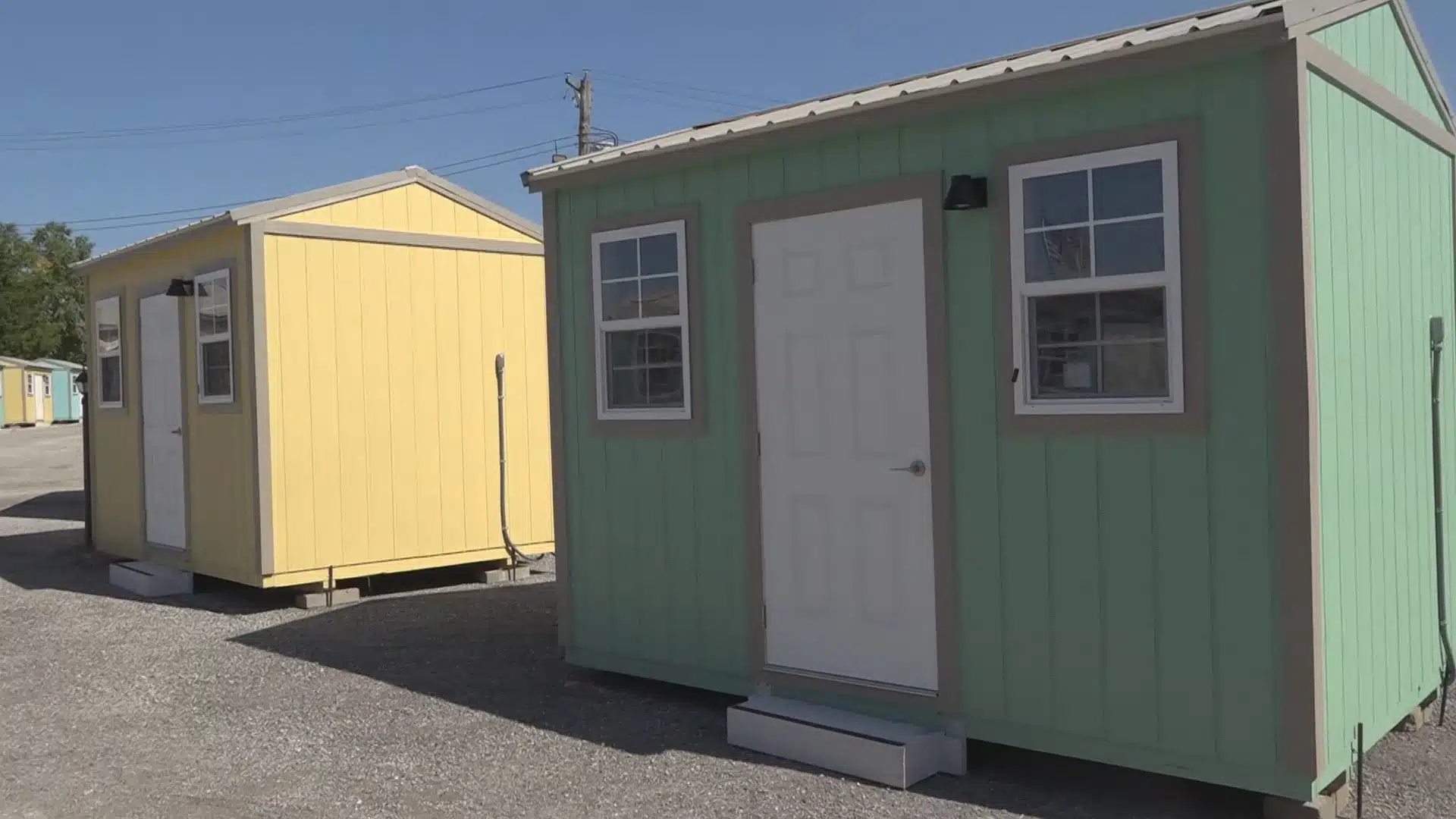 Colorful tiny homes at a transitional housing village in St. Louis, part of the city's Tiny Homes Project for unhoused residents.