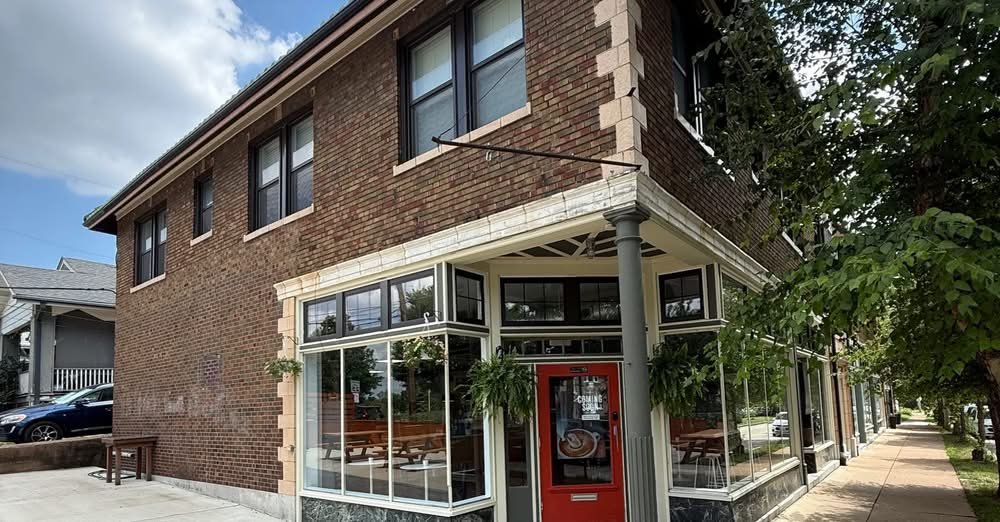 kentzo koffee maplewood opens with community roots and clean vibes 1 Exterior view of Kentzo Koffee in Maplewood, Missouri, with red door entrance and sidewalk seating