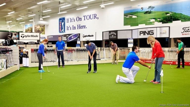 Golfers practice putting at the new PGA TOUR Superstore St. Louis location in Manchester, Missouri.