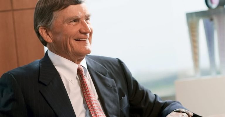 Thomas Cousins, former co-owner of the St. Louis Hawks, wearing a suit and smiling during an interview.