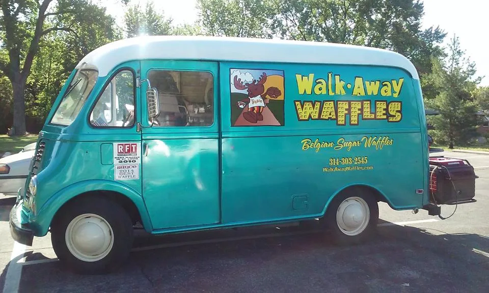 Walk Away Waffles food truck parked in Kirkwood, Missouri, featuring teal paint and branding for Belgian sugar waffles.
