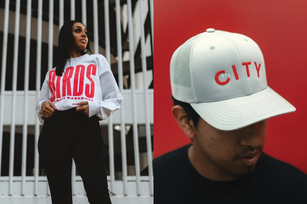 Two models wear Arch Apparel products, highlighting the brand’s St. Louis identity amid its local investment campaign.
