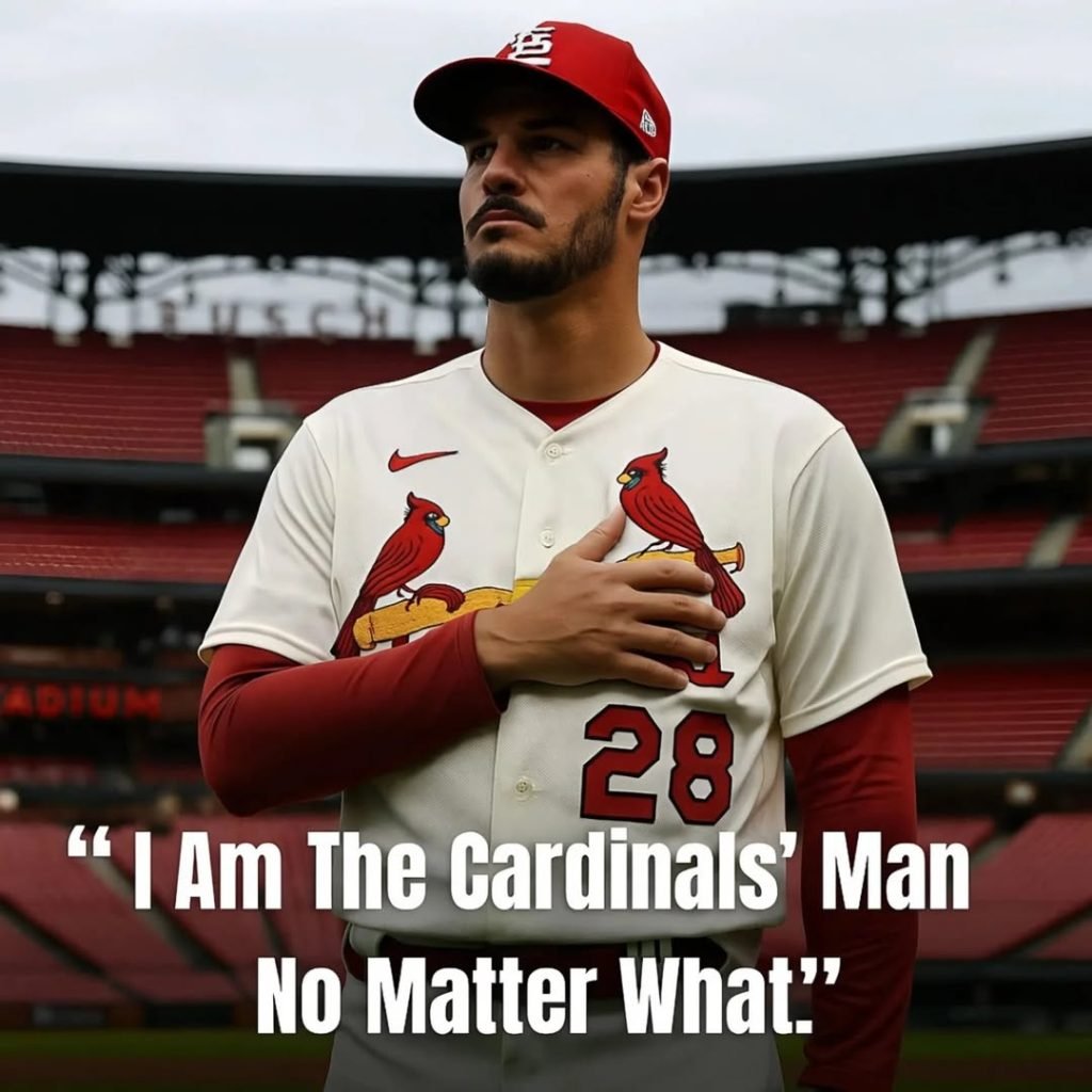 Nolan Arenado standing in Busch Stadium wearing St. Louis Cardinals jersey with hand over heart, quote overlay reads "I Am The Cardinals’ Man No Matter What"