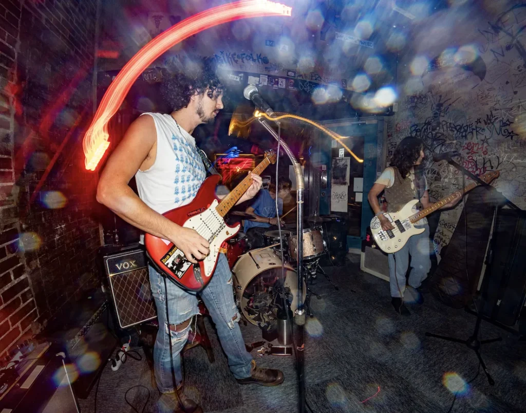 St. Louis rock band performing live at a small venue during Free 4 All STL music showcase