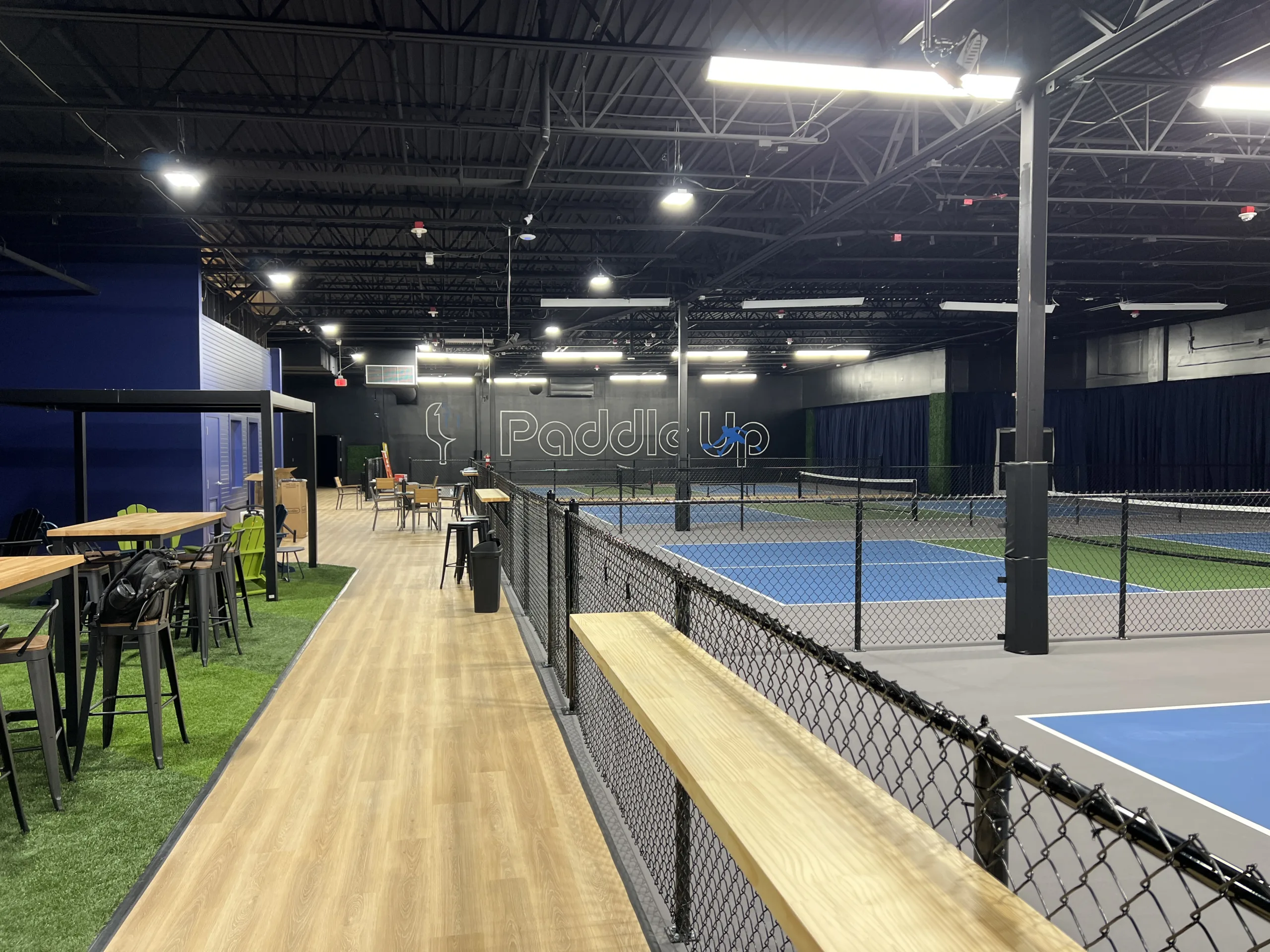 Indoor pickleball courts at Paddle Up Pickleball Chesterfield inside The District